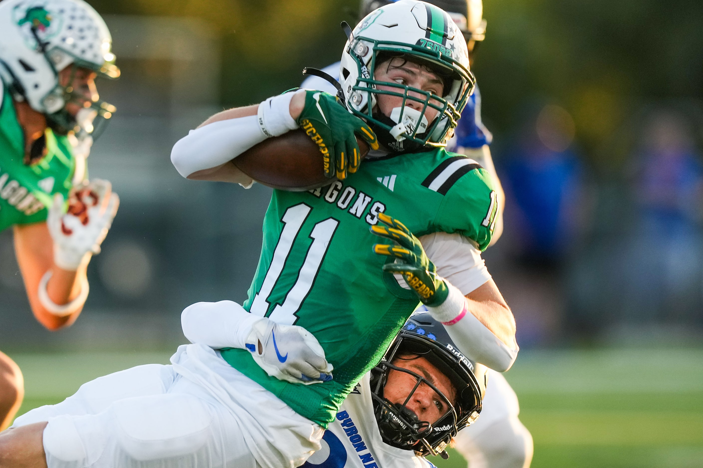 Southlake Carroll wide receiver Brock Boyd (11) is brought down by Trophy Club Byron...