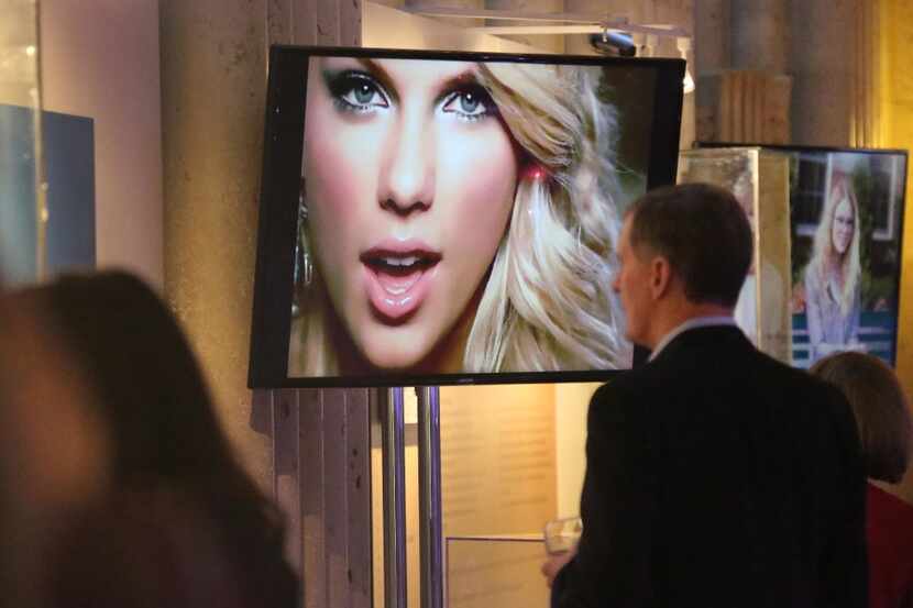 Some of Swift's most memorable music videos, which play on a loop at the display, serve to...