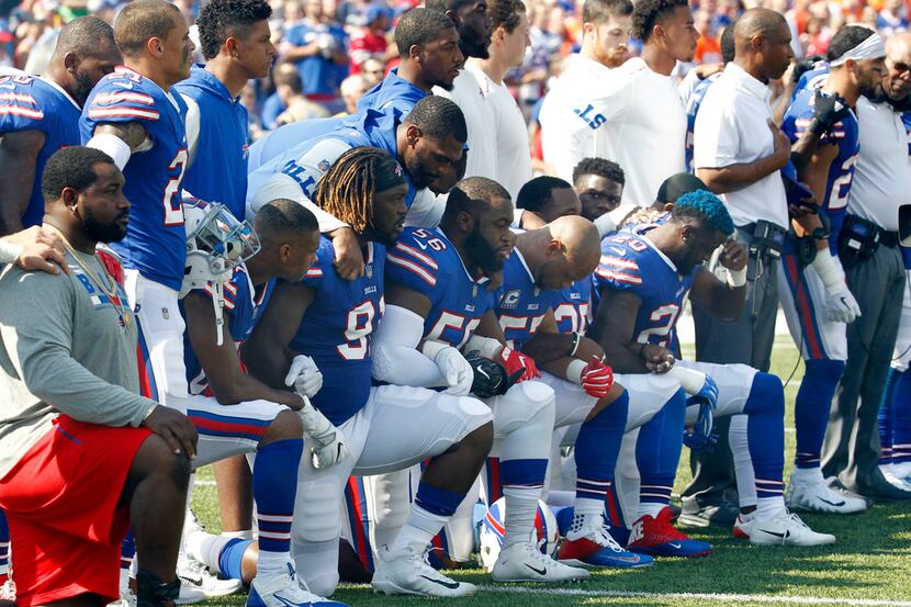 In this Sunday, Sept. 24, 2017, file photo, Buffalo Bills players take a knee during the...