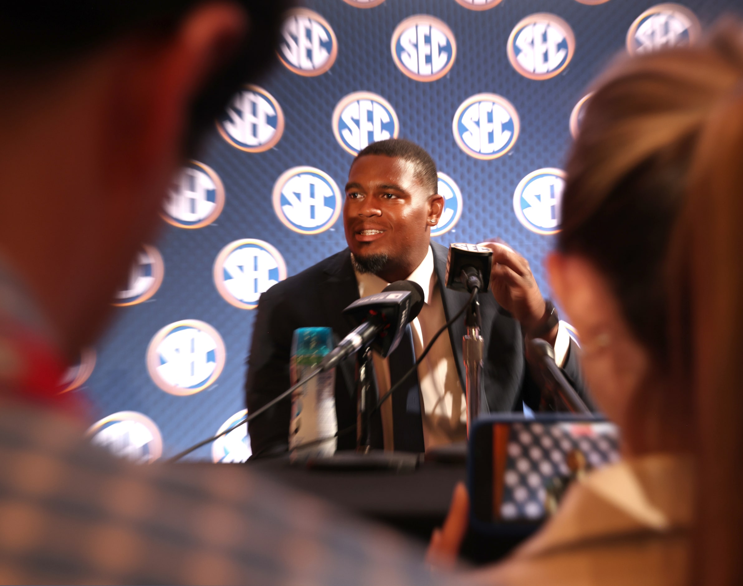 Texas Longhorns offensive tackle Kelvin Banks Jr.listens to a question from a media member...