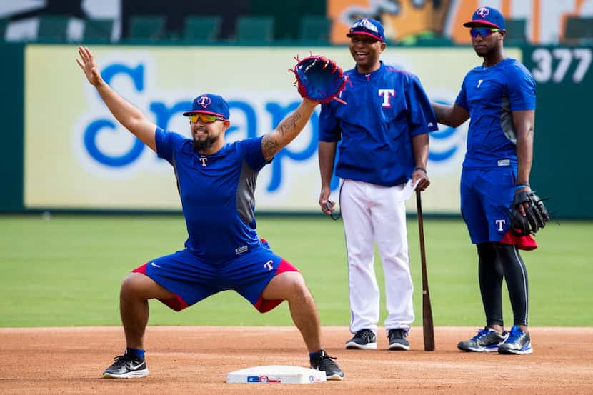 Texas Rangers second baseman Rougned Odor calls for a relay as infielder Jurickson Profar...