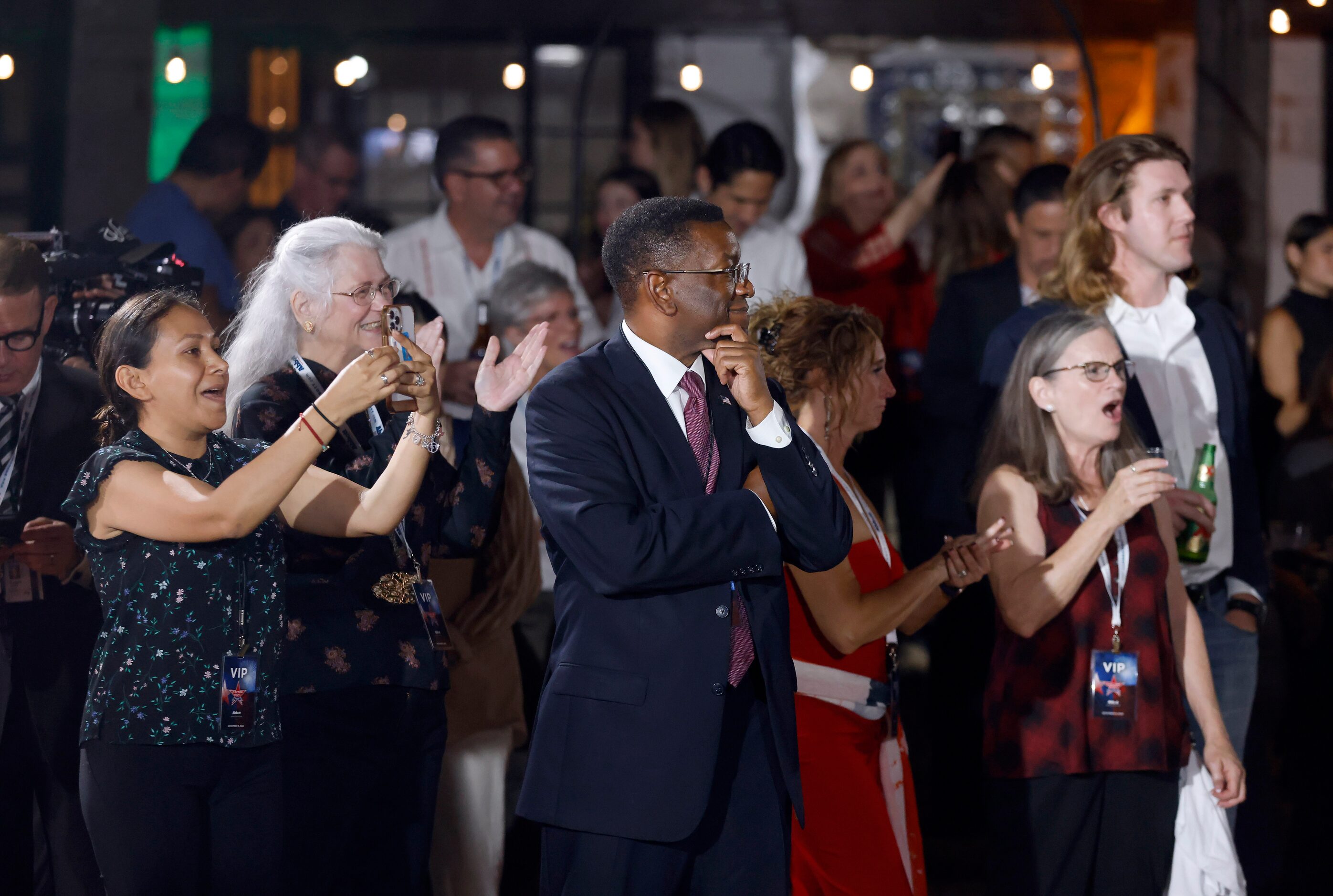 Supporters of Texas Governor Greg Abbott celebrate the early returns of the gubernatorial...