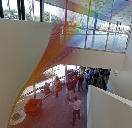  Visitors touring the new Resource Center passed underÂ Gabriel Dawe's string-art piece...