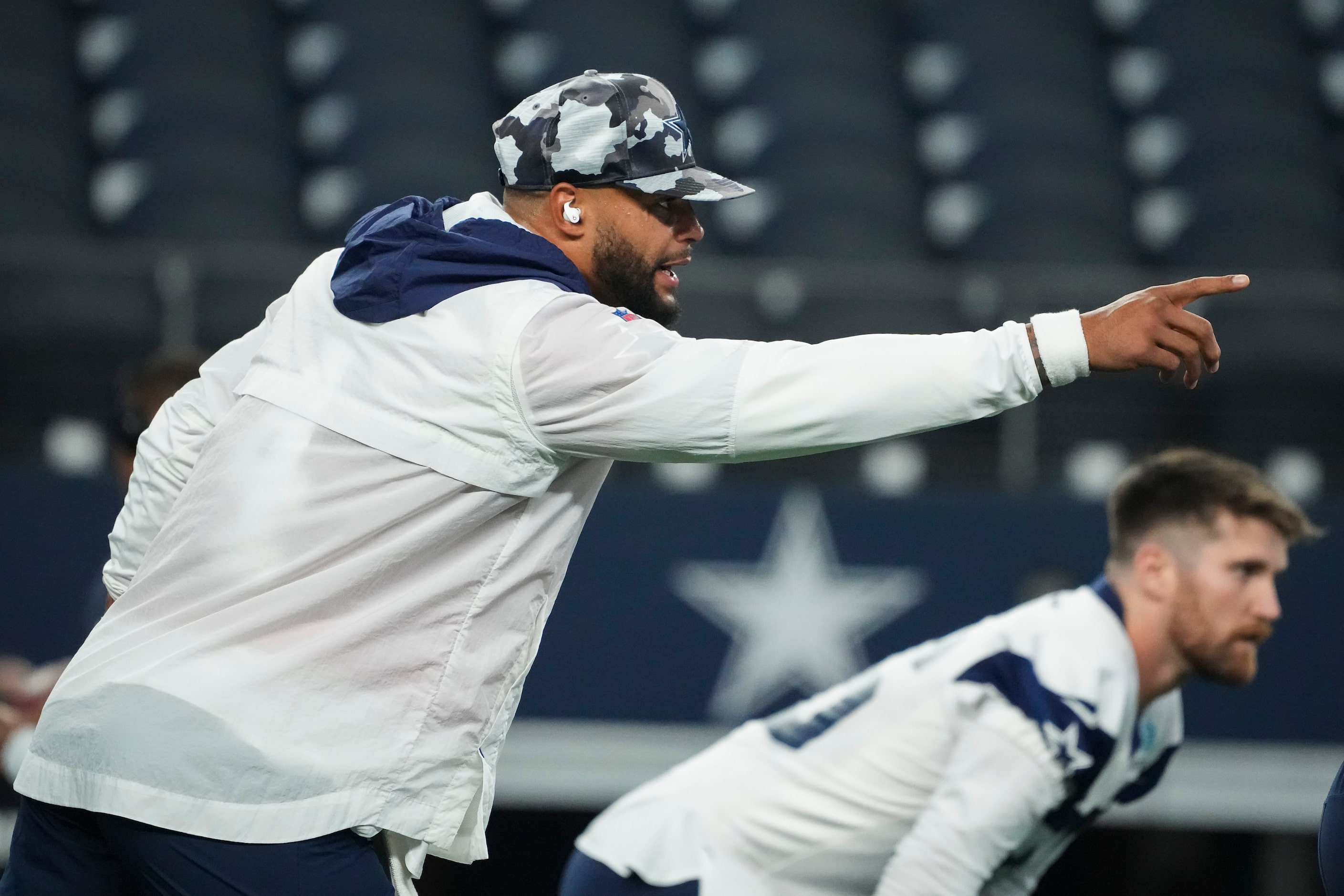 Dallas Cowboys quarterback Dak Prescott warms up before an NFL preseason football game...