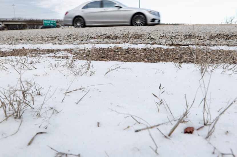 A car passed wind-blown snow last year along U.S. Highway 67 and Interstate 20 in southern...
