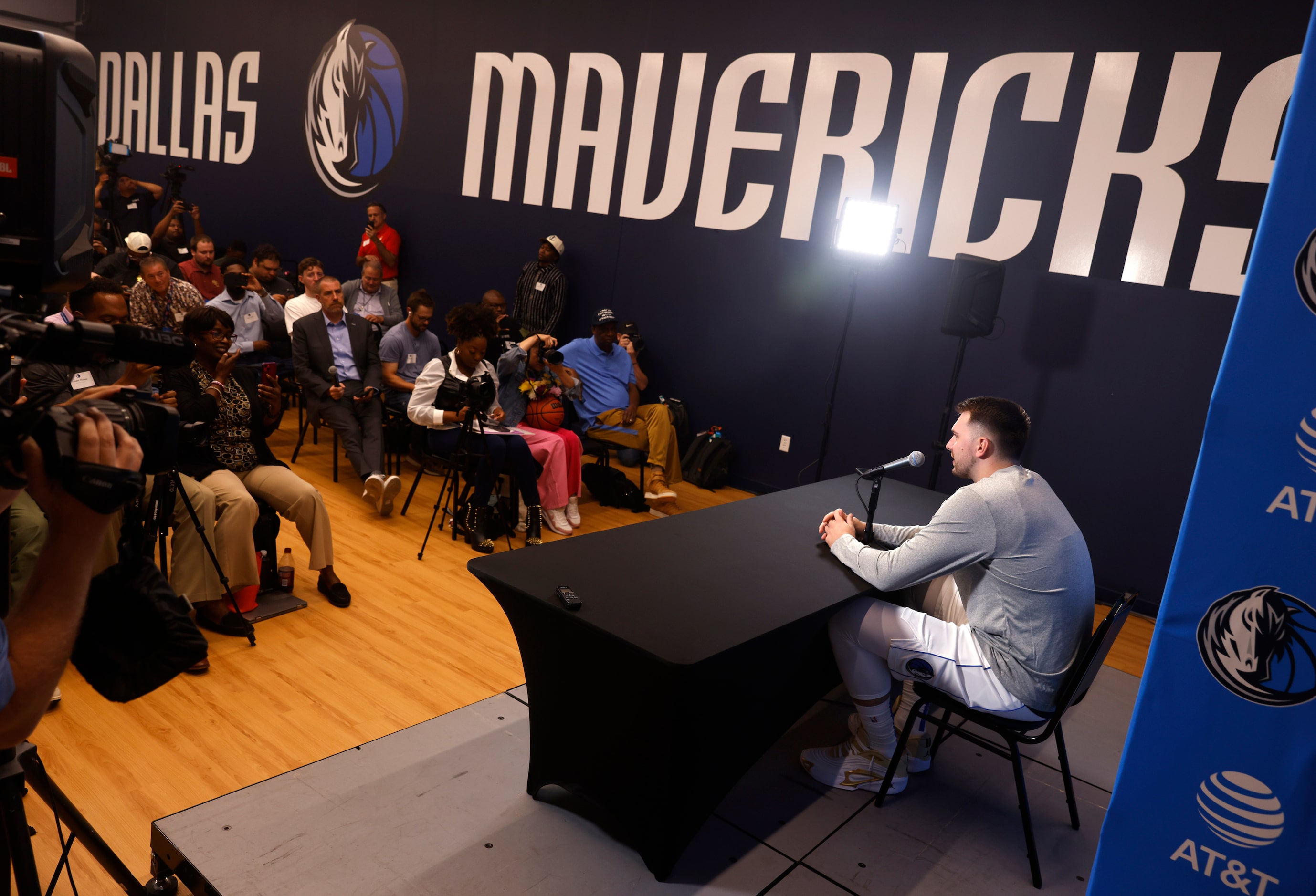 Dallas Mavericks guard Luka Doncic (77) fields questions from the media during media day at...