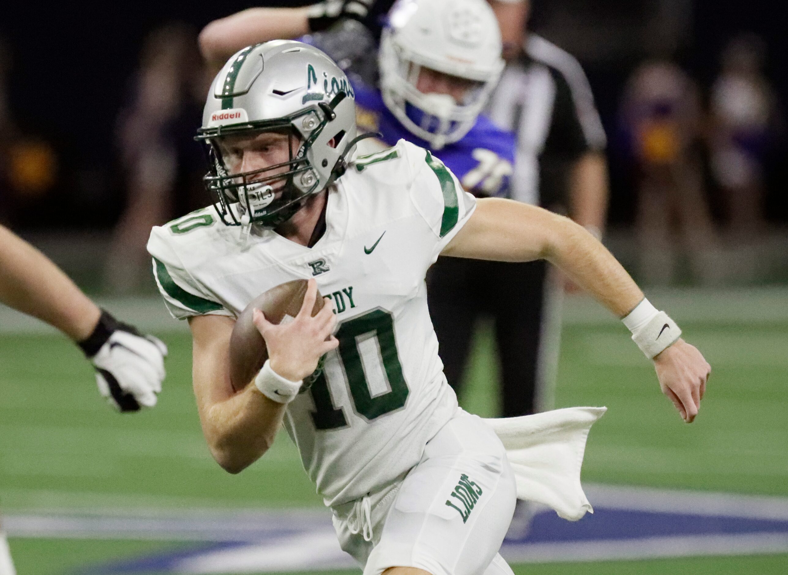 Reedy High School quarterback Jake Ferner (10) runs the football during the first half as...