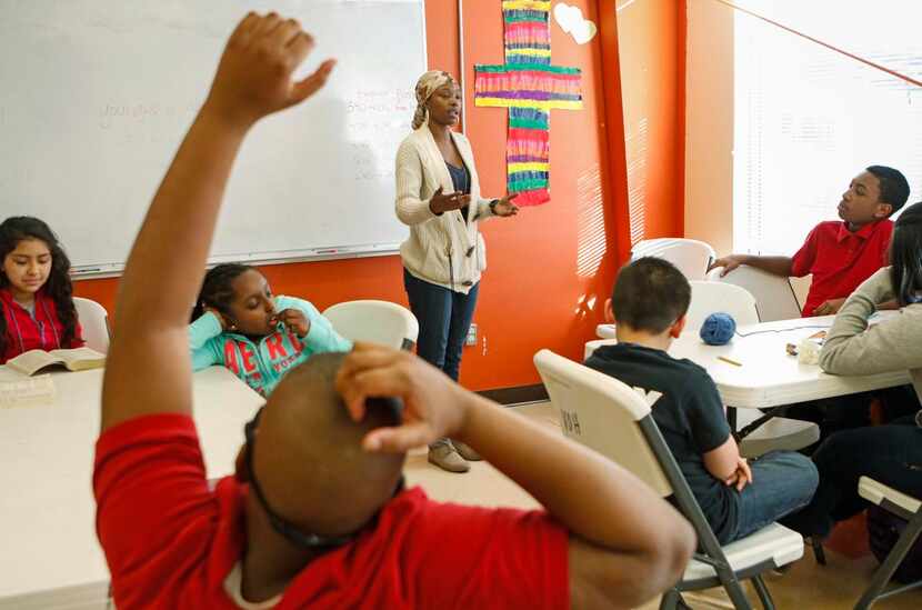 
Garner (center) teaches a lesson about conflict resolution at Voice of Hope.
