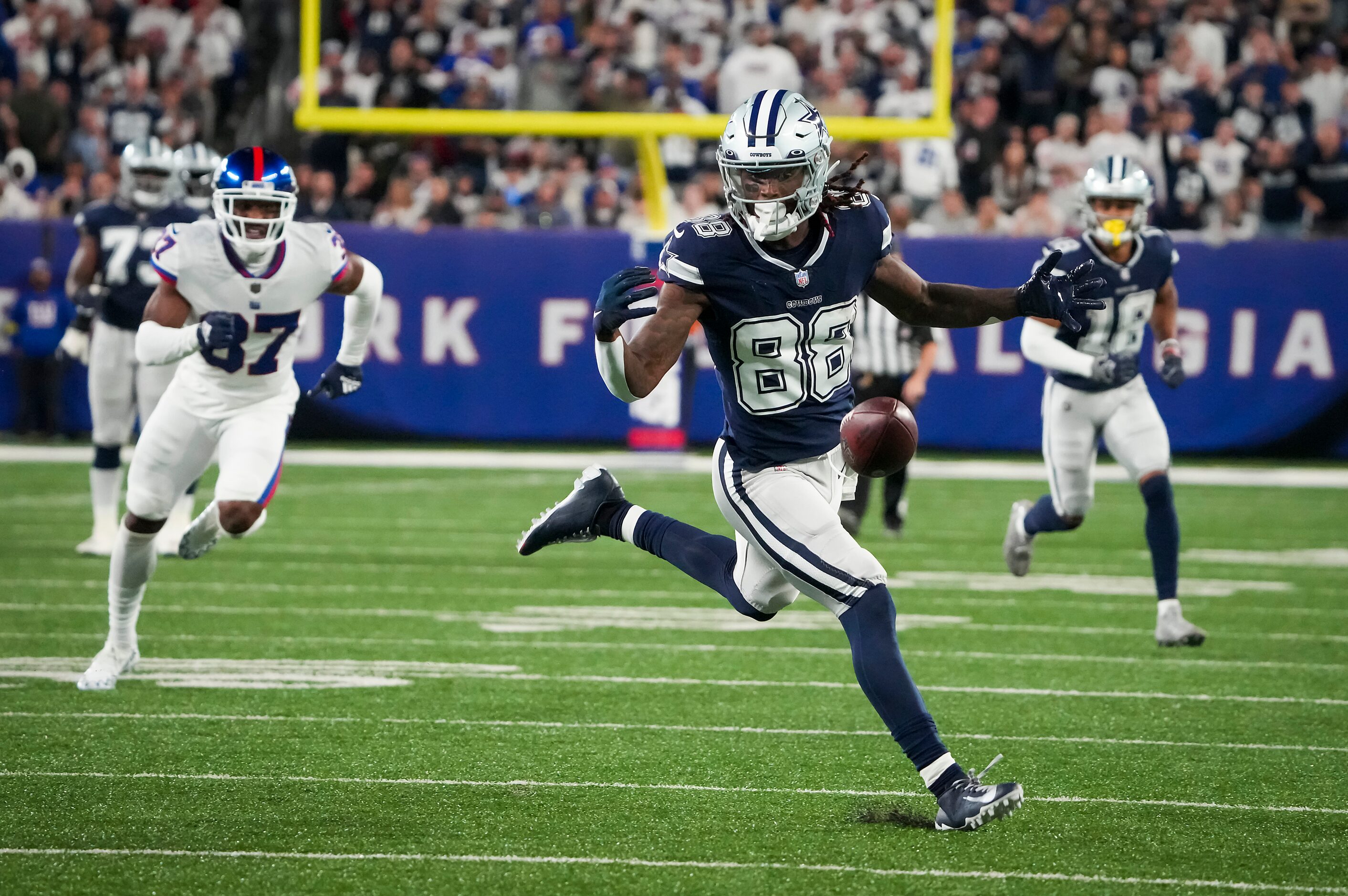 Dallas Cowboys wide receiver CeeDee Lamb (88) drops a pass after getting past the New York...