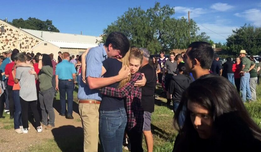 People gathered near the Alpine High School campus Thursday after a shooting at the school.