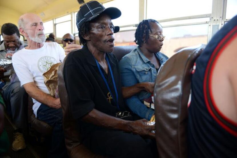 
Allen and Eva Matheny ride the bus from the shelter to an evening service at CitiChurch of...