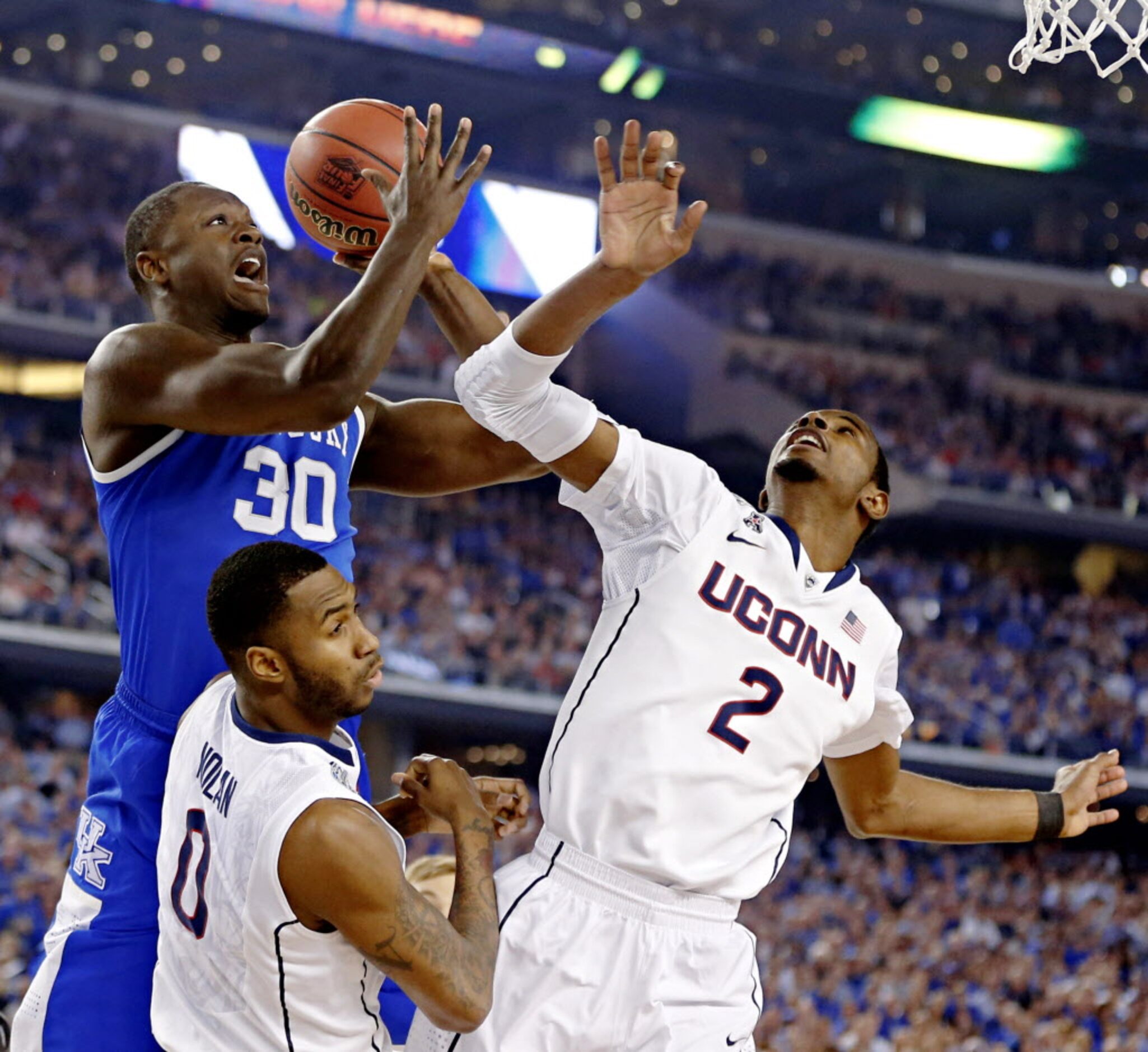 Kentucky Wildcats forward Julius Randle (30) goes against Connecticut Huskies forward...