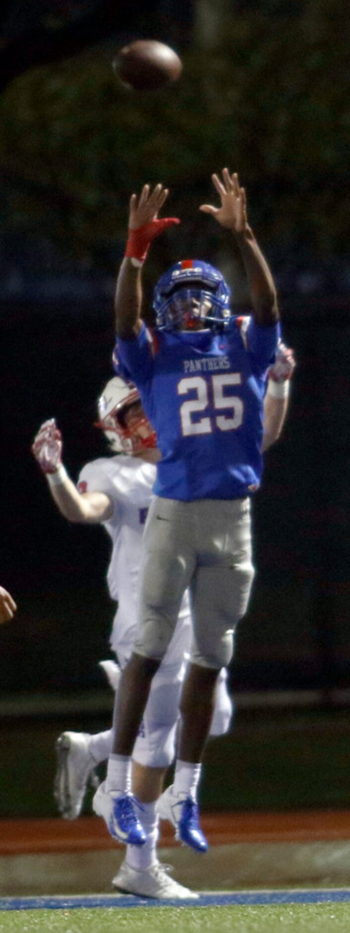 Duncanville defensive back Thailand Scott (25) leaps to  intercept a pass during first half...