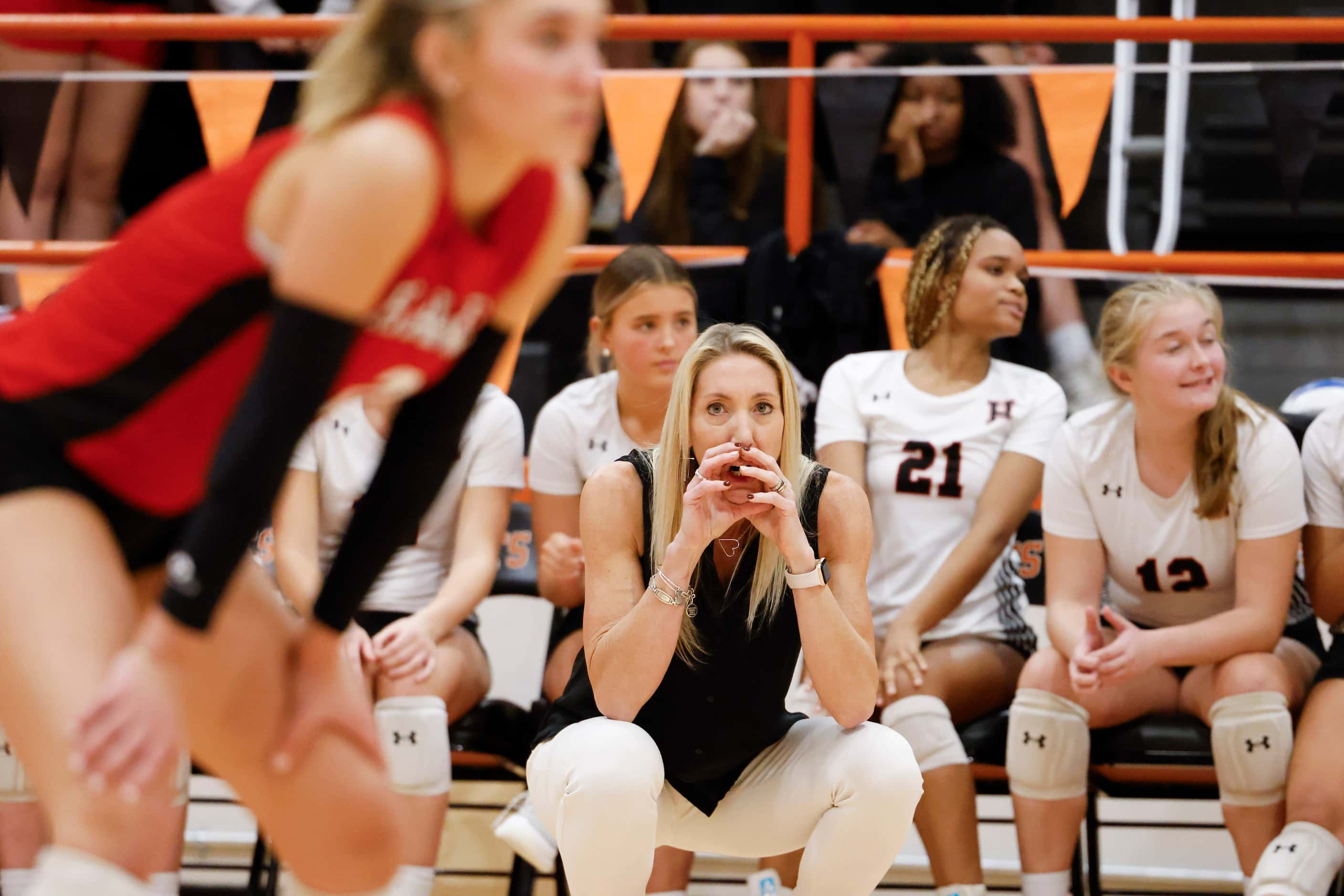 Rockwall Heath’s head coach Maggie Younger instructs the team during a volleyball game...