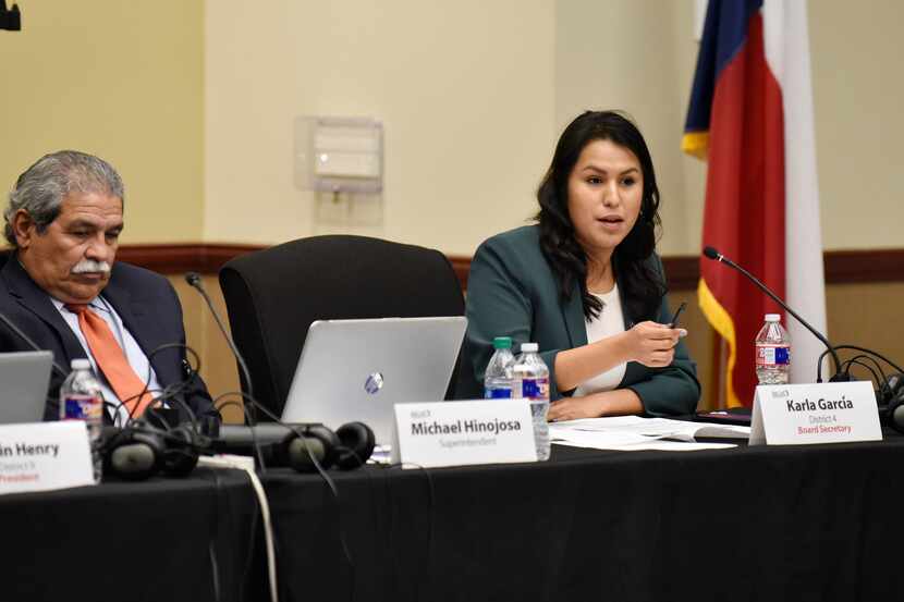 Dallas ISD trustee Karla Garcia, of District 4, right, speaks during a DISD board meeting at...
