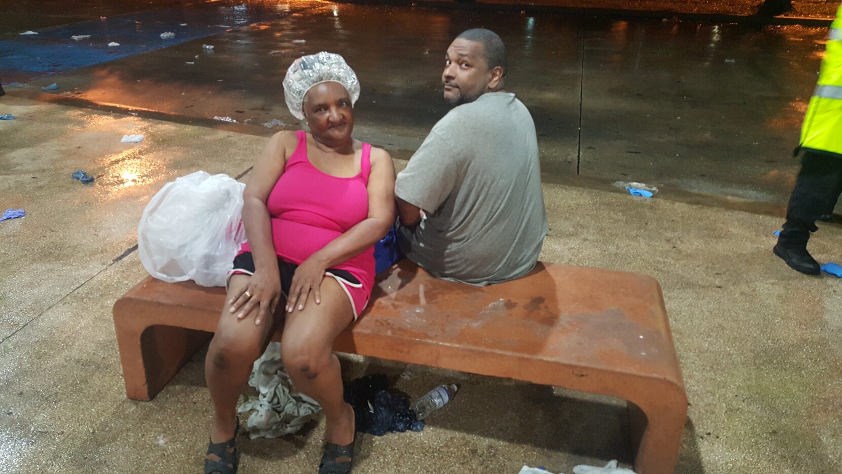 Beatrice Baines, 75, and her son, Fred Gistarb, wait to be taken to an evacuation center...