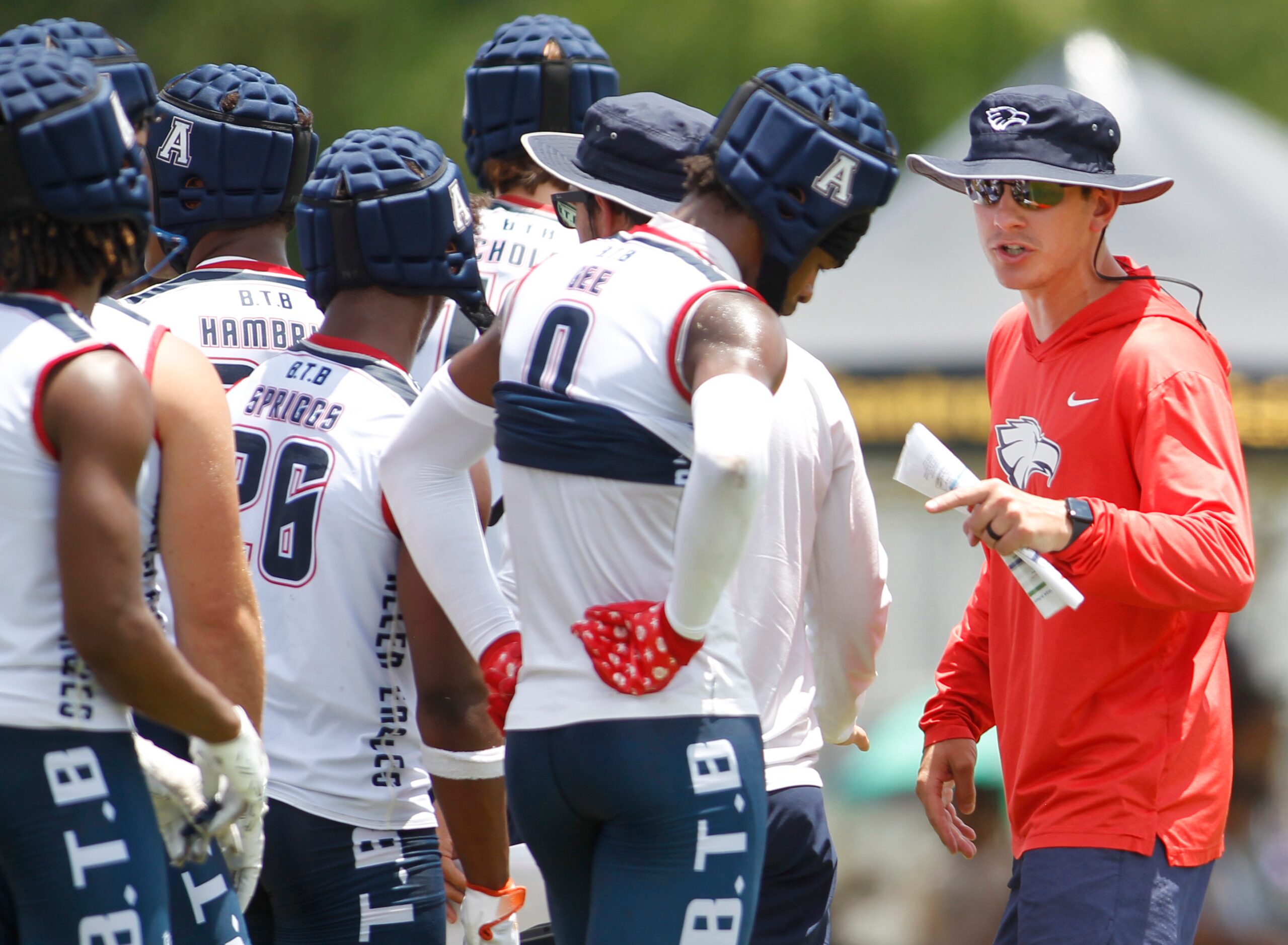 An Allen coaching staff member shares some wisdom with Eagles players during halftime of...