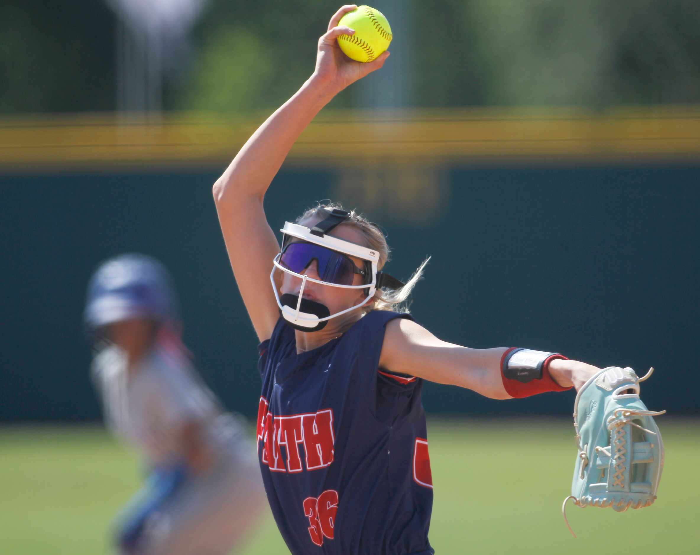 Grapevine Faith Christian pitcher Makenzie Byler (36) delivers a pitch to a Victoria St....