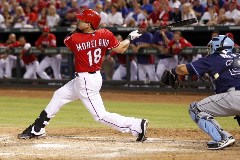 Sep 30, 2013; Arlington, TX, USA; Texas Rangers first baseman Mitch Moreland (18) hits a...