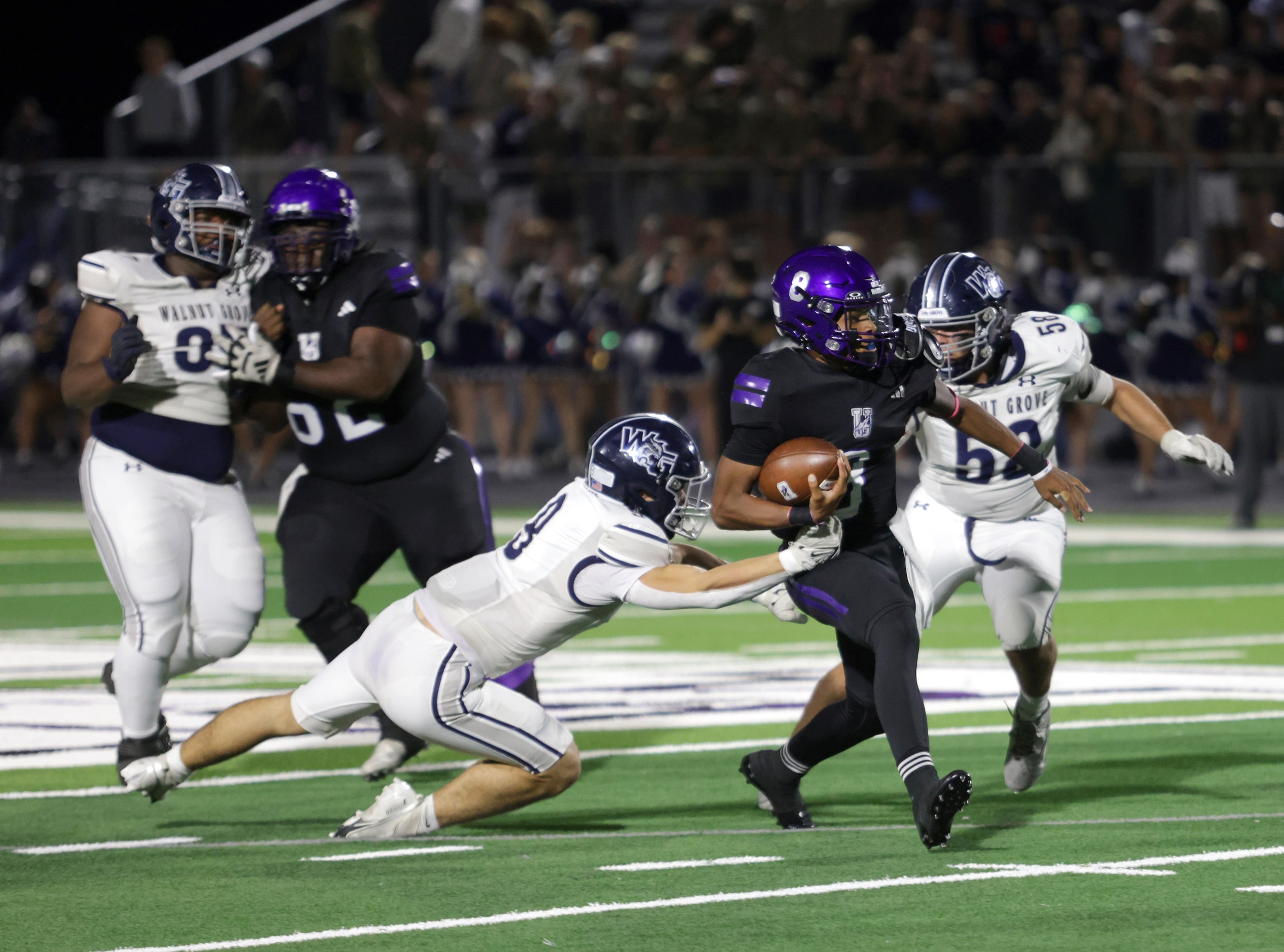 Anna player #8 Ziondre Williams runs the ball during the Prosper Walnut Grove High School...