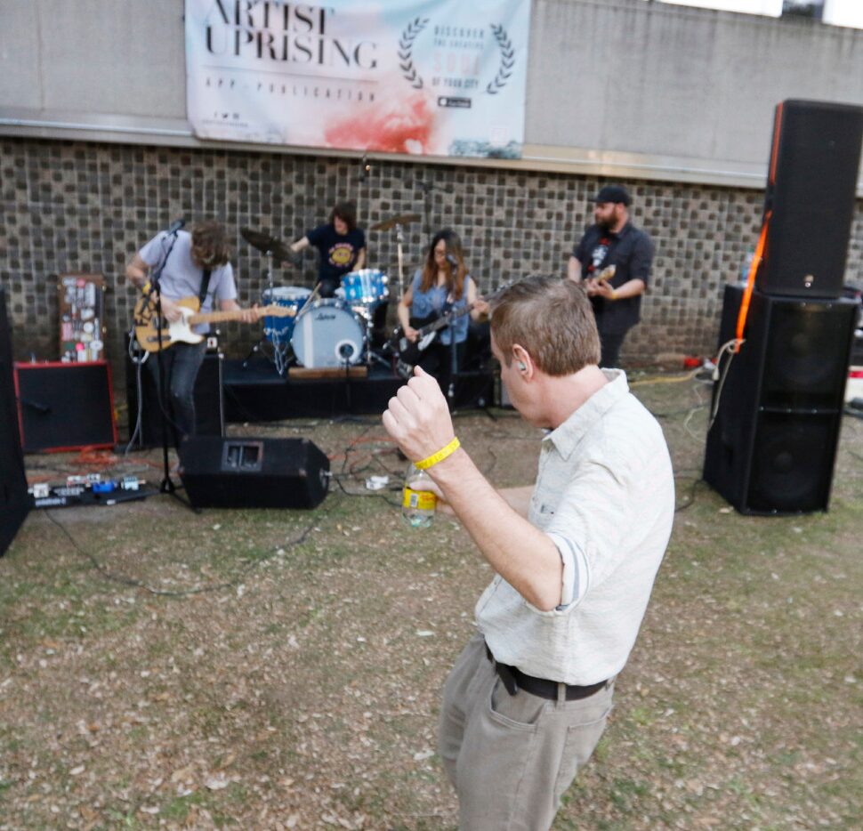 Tom Bannon dances to the music of Sealion, one of the bands that performed at the Artist...