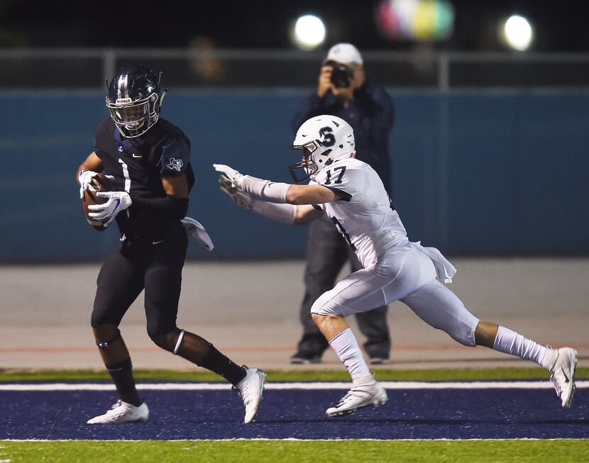 Liberty Christian wide receiver Jaelin McCoslin (1) catches a touchdown pass in front of All...