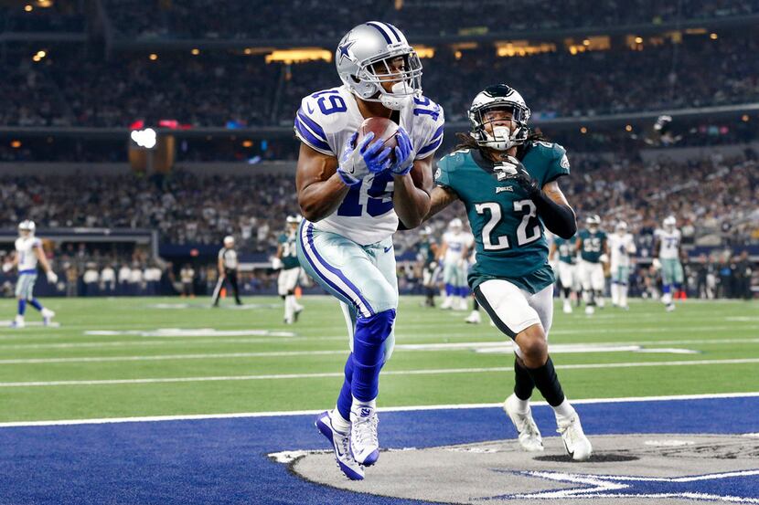 Dallas Cowboys wide receiver Amari Cooper (19) pulls in a long touchdown pass in the end...