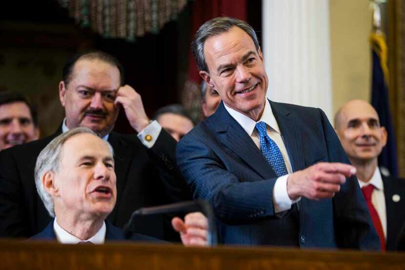 Texas Gov. Greg Abbott and state Rep. Joe Straus, speaker of the Texas House, are pictured...
