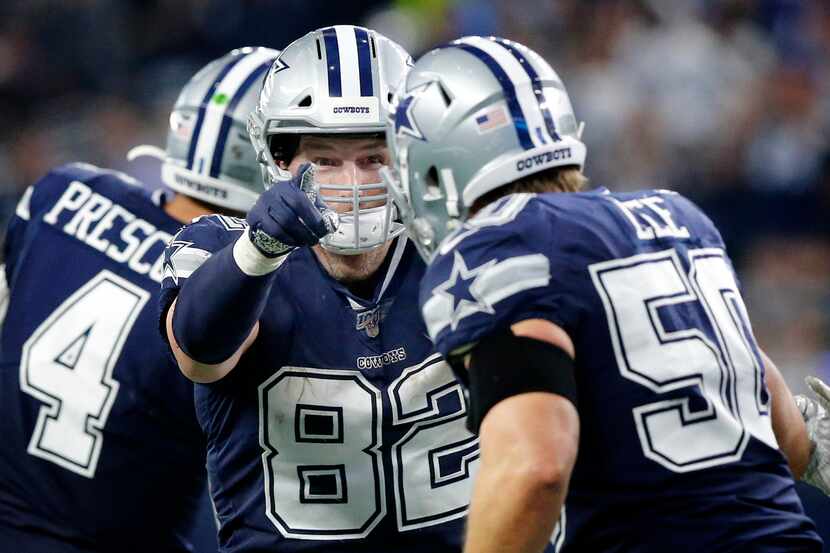 Dallas Cowboys tight end Jason Witten (82) congratulates outside linebacker Sean Lee (50) on...