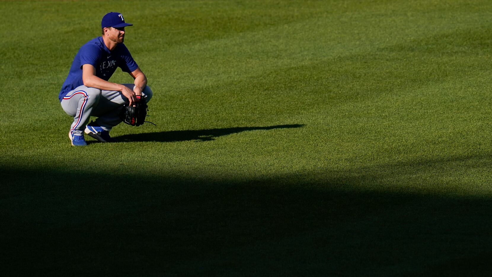 Texas Rangers pitcher Jacob deGrom works out prior to a baseball game against the Baltimore...