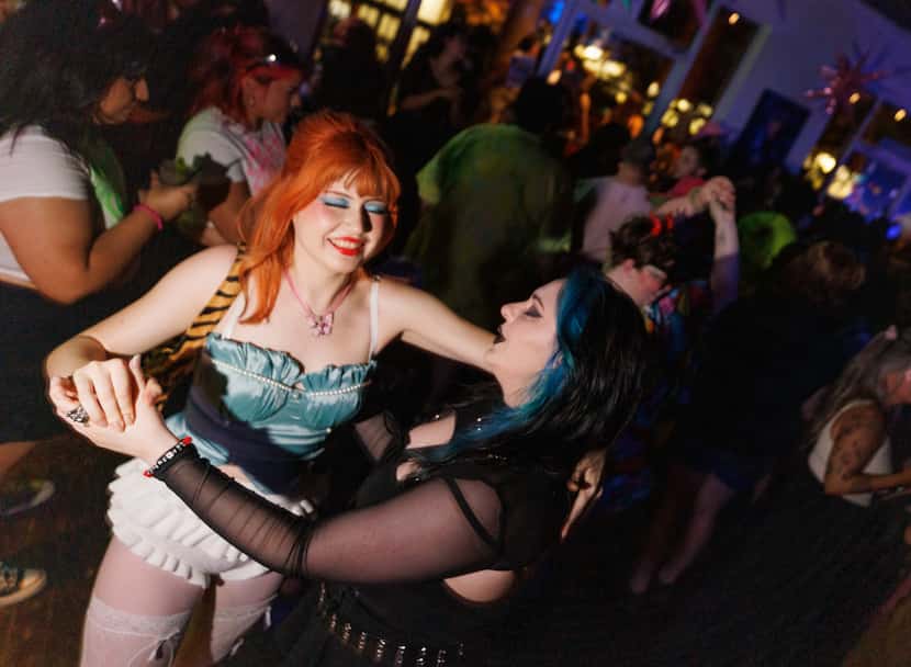 People dance during a Charli XCX and Chappell Roan-themed bar night at Sue Ellen's in...