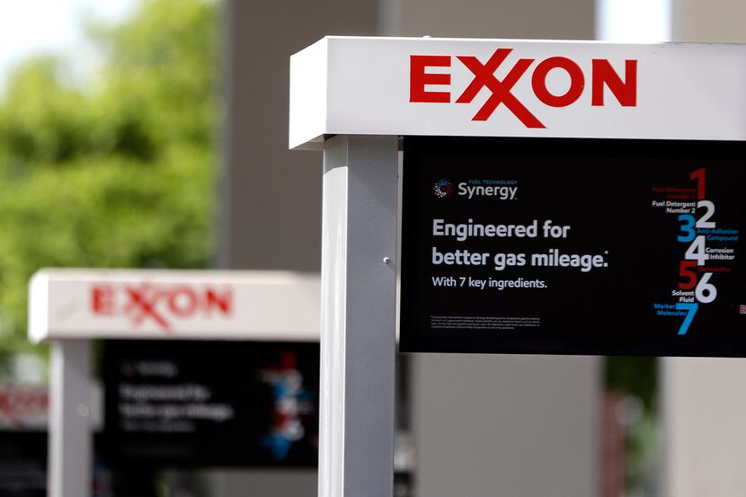 This April 25, 2017, photo, shows Exxon service station signs in Nashville, Tenn. Exxon...