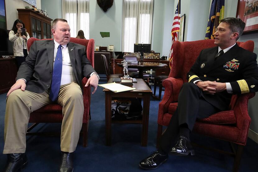 U.S. Navy Rear Admiral Ronny Jackson (right) meets with Sen. Jon Tester (D-Montana) in his...