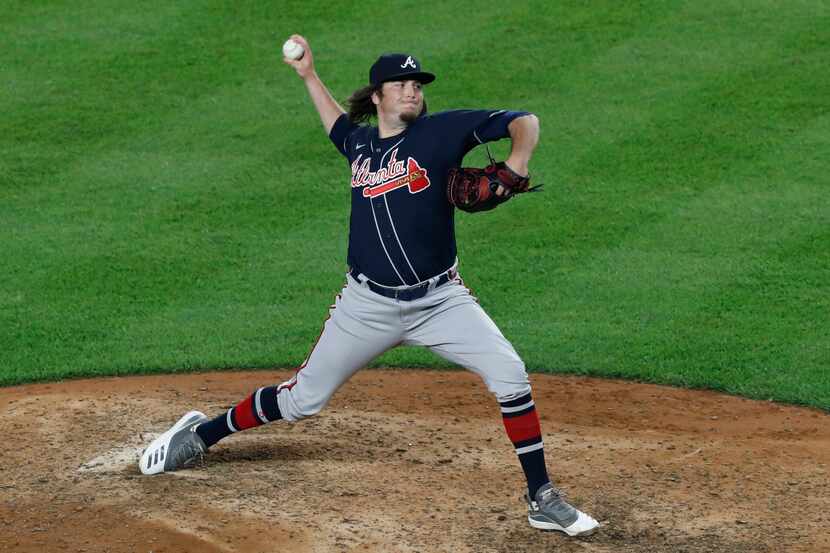 Atlanta Braves relief pitcher Luke Jackson winds up during the seventh inning of the team's...