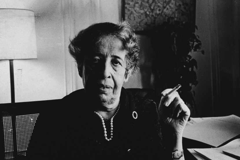 Hannah Arendt, a German-American philosophy professor, smokes a cigarette at her apartment...