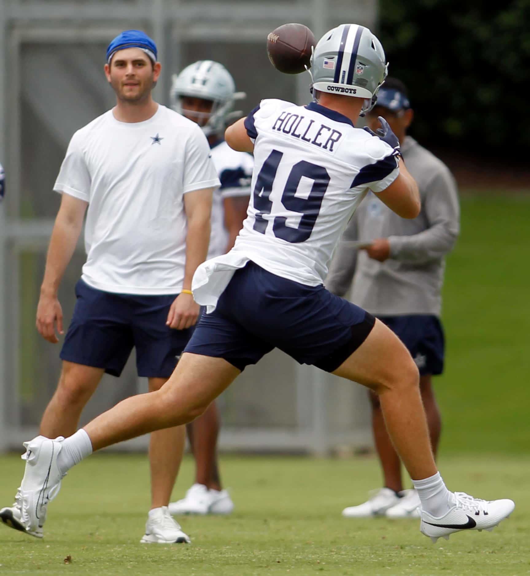 Dallas Cowboys tight end Alec Holler (49) pulls in a pass on a crossing route during a...