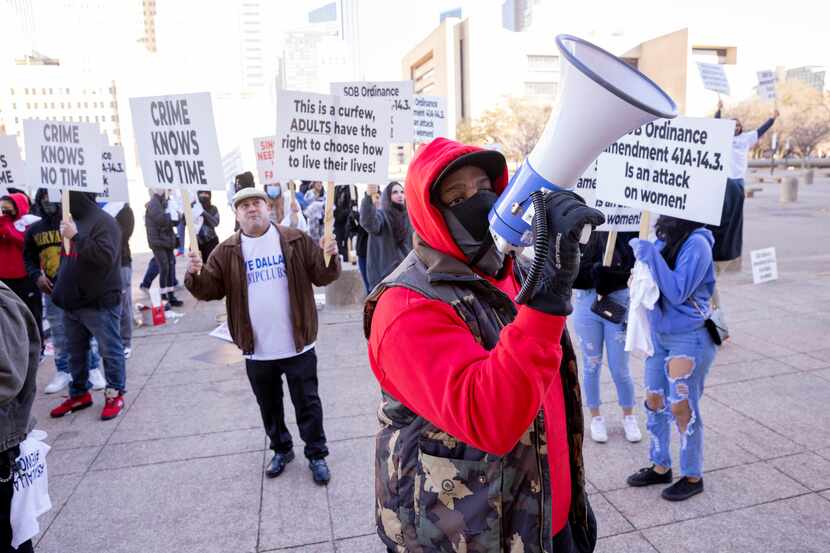 Protesters outside Dallas City Hall in January 2022 urge city officials not to approve a...