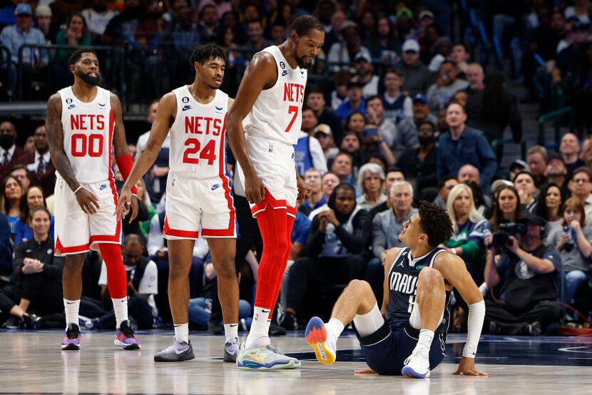 Dallas Mavericks guard Josh Green (8) reacts after being fouled by Brooklyn Nets forward...