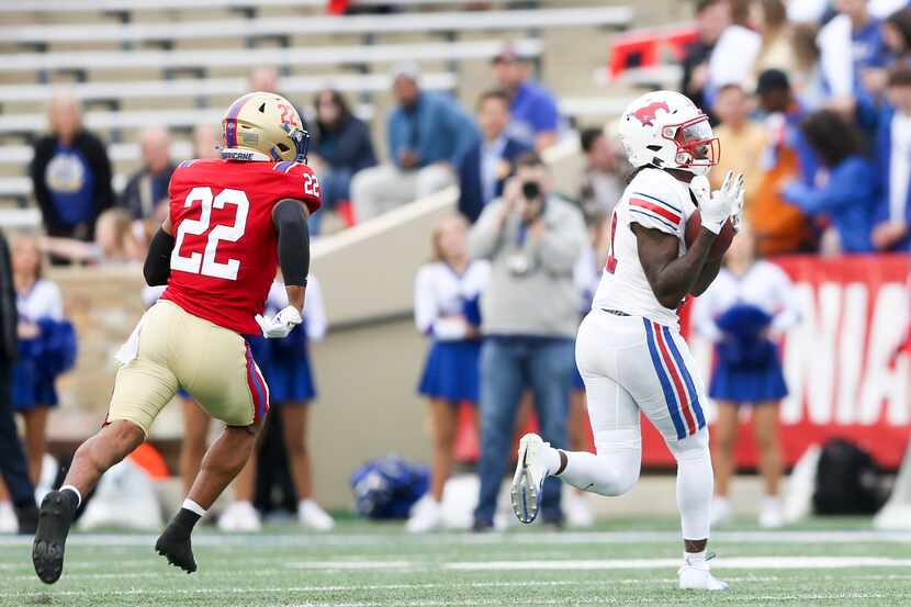 SMU wide receiver Rashee Rice catches a pass while Tulsa safety LJ Wallace (22) defends...