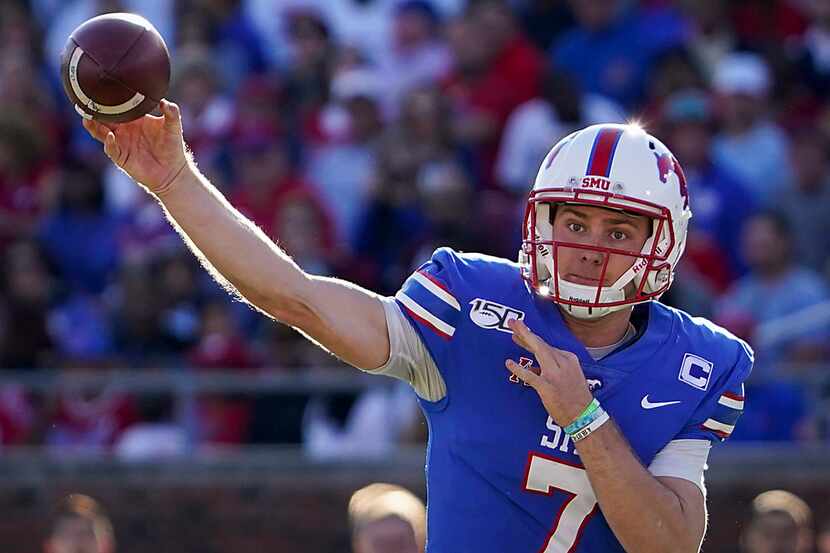 SMU quarterback Shane Buechele (7) throws a pass during the first half of an NCAA football...