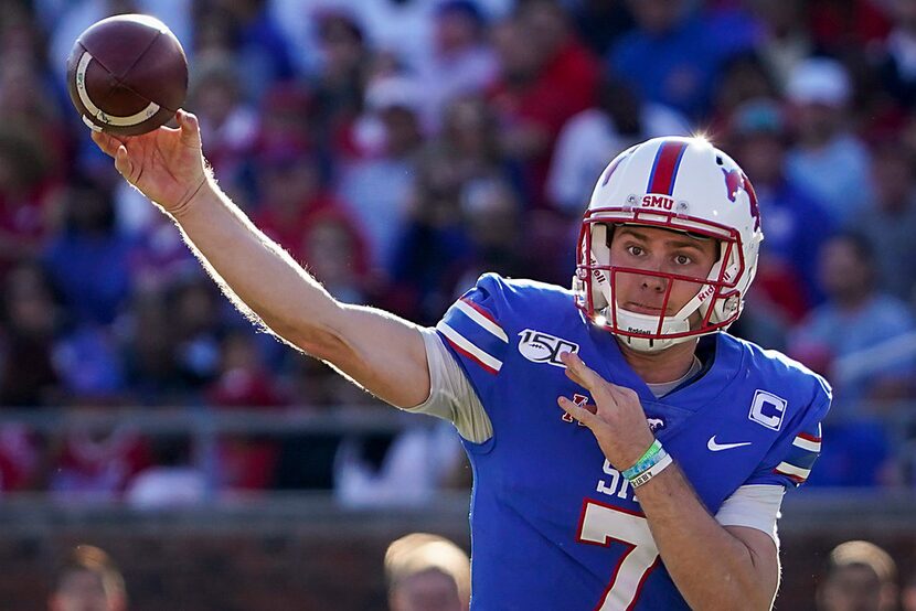 SMU quarterback Shane Buechele (7) throws a pass during the first half of an NCAA football...