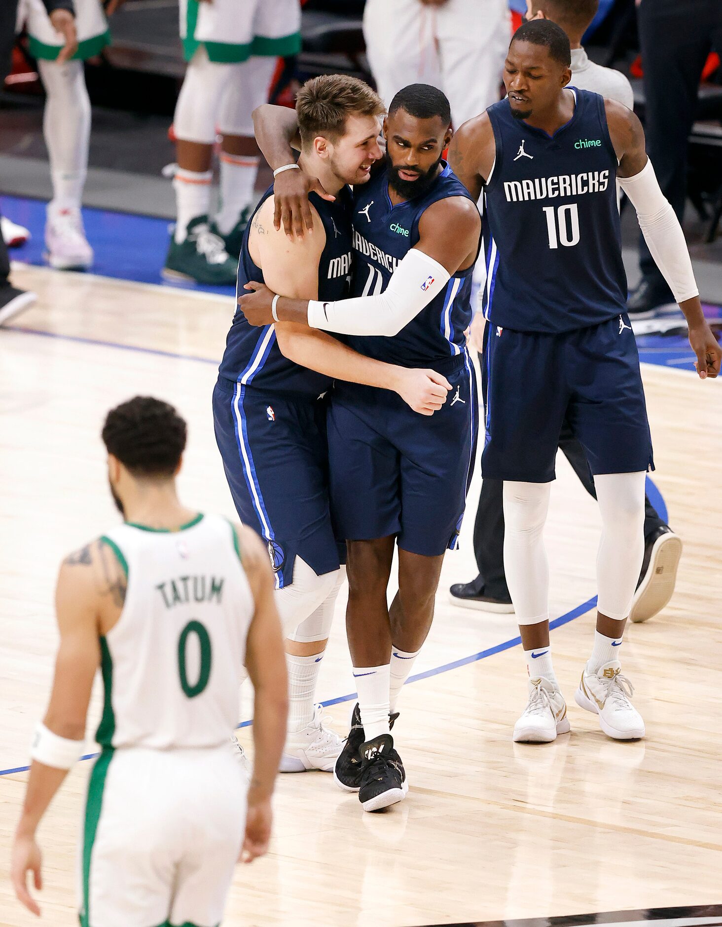 Dallas Mavericks guard Luka Doncic (77) celebrates his game-winning shot with forward Tim...