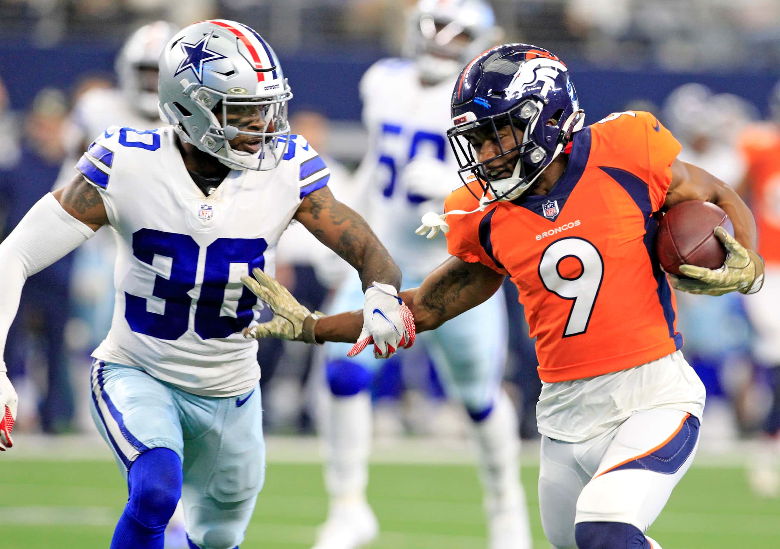 Dallas Cowboys cornerback Anthony Brown (30) cuts off Denver Broncos wide receiver Kendall...
