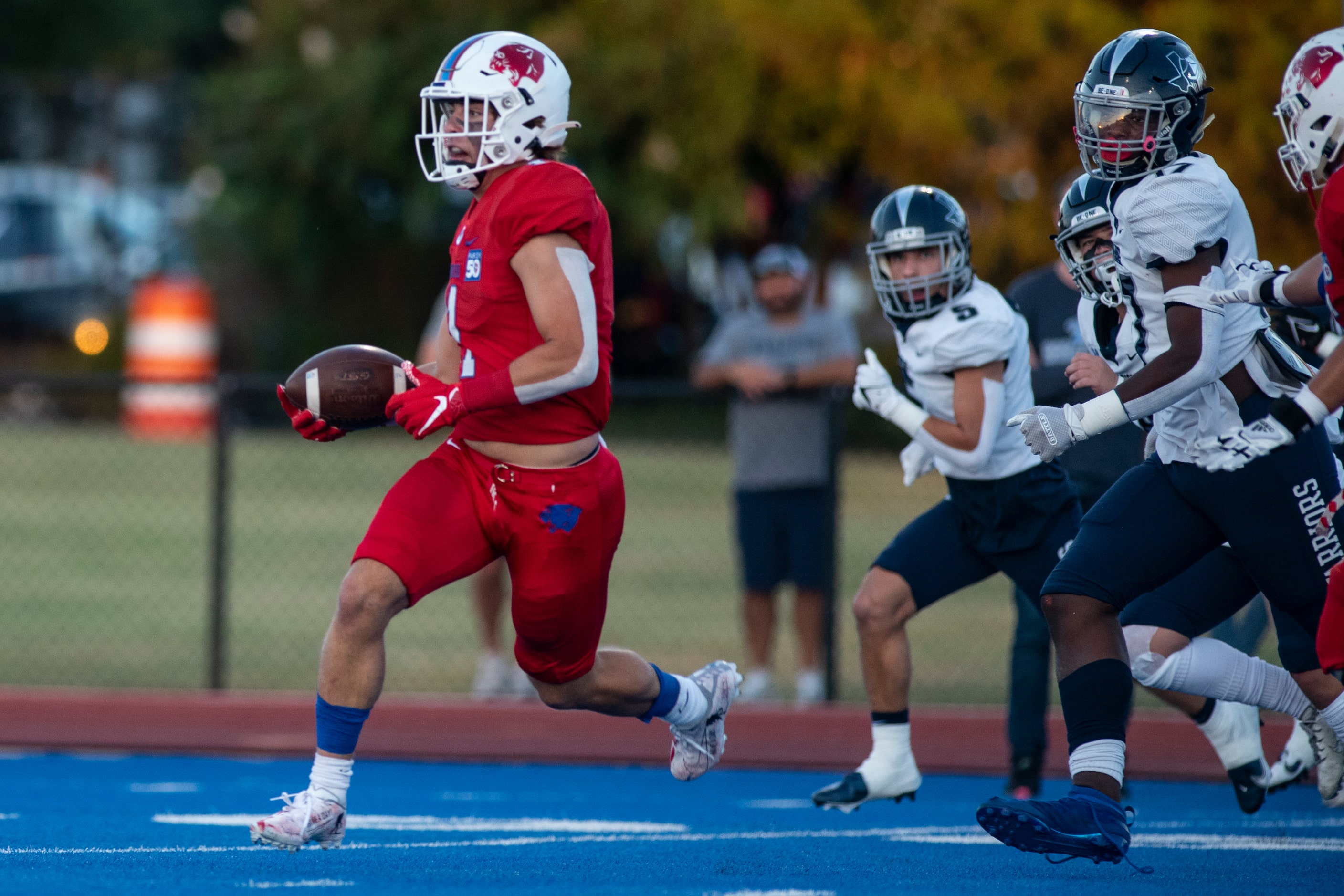 Parish Episcopal senior Blake Youngblood (1) gains yardage after catching a pass during...