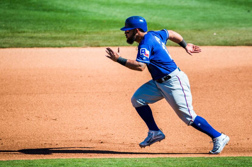 Texas Rangers second baseman Rougned Odor (12) steals second base during the fourth inning...