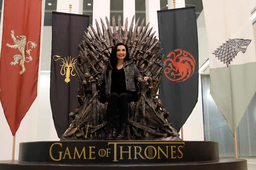 Denisa Ulloa of Dallas sits in a replica of the Iron Throne from the HBO TV series "Game of...