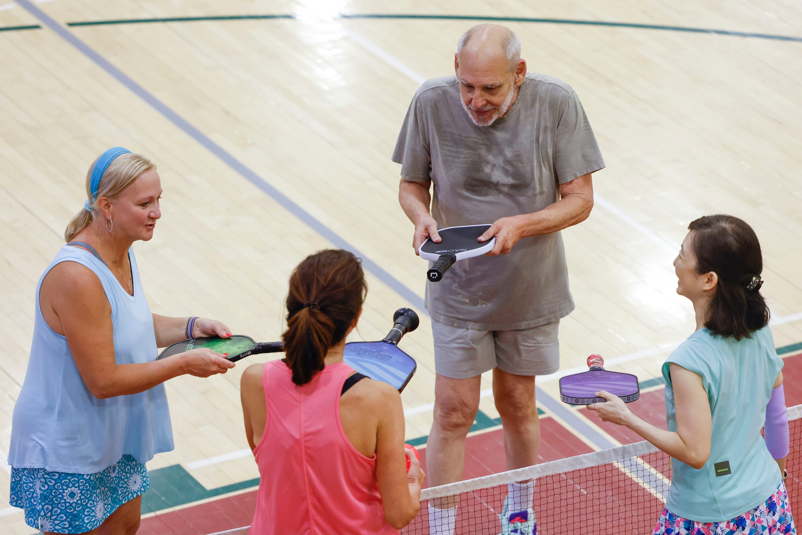 From left, Plano residents Holly Brown, Alan Grove and Elaine Tan of Plans approach with...