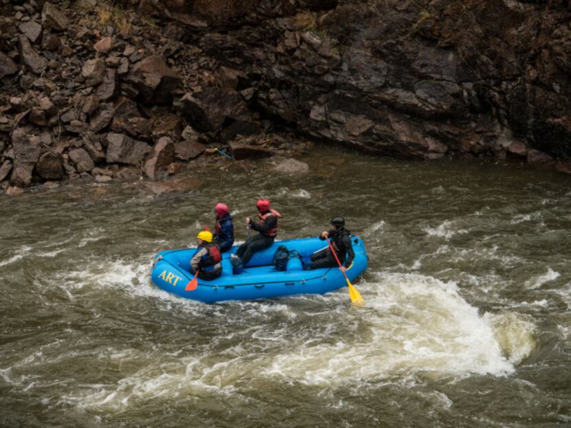 Rafters splash down the the Arkansas River in Colorado. The route through Royal Gorge...