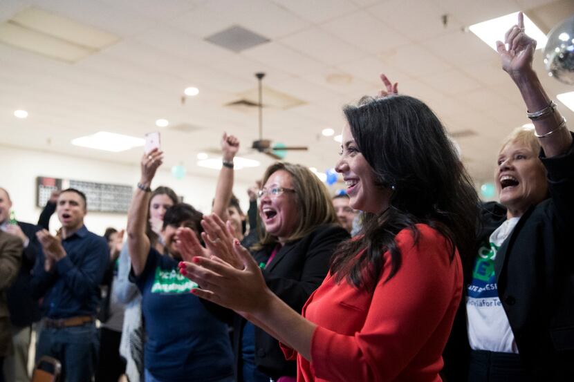  Victoria Neave and supporters cheer  the results during her election night party. 