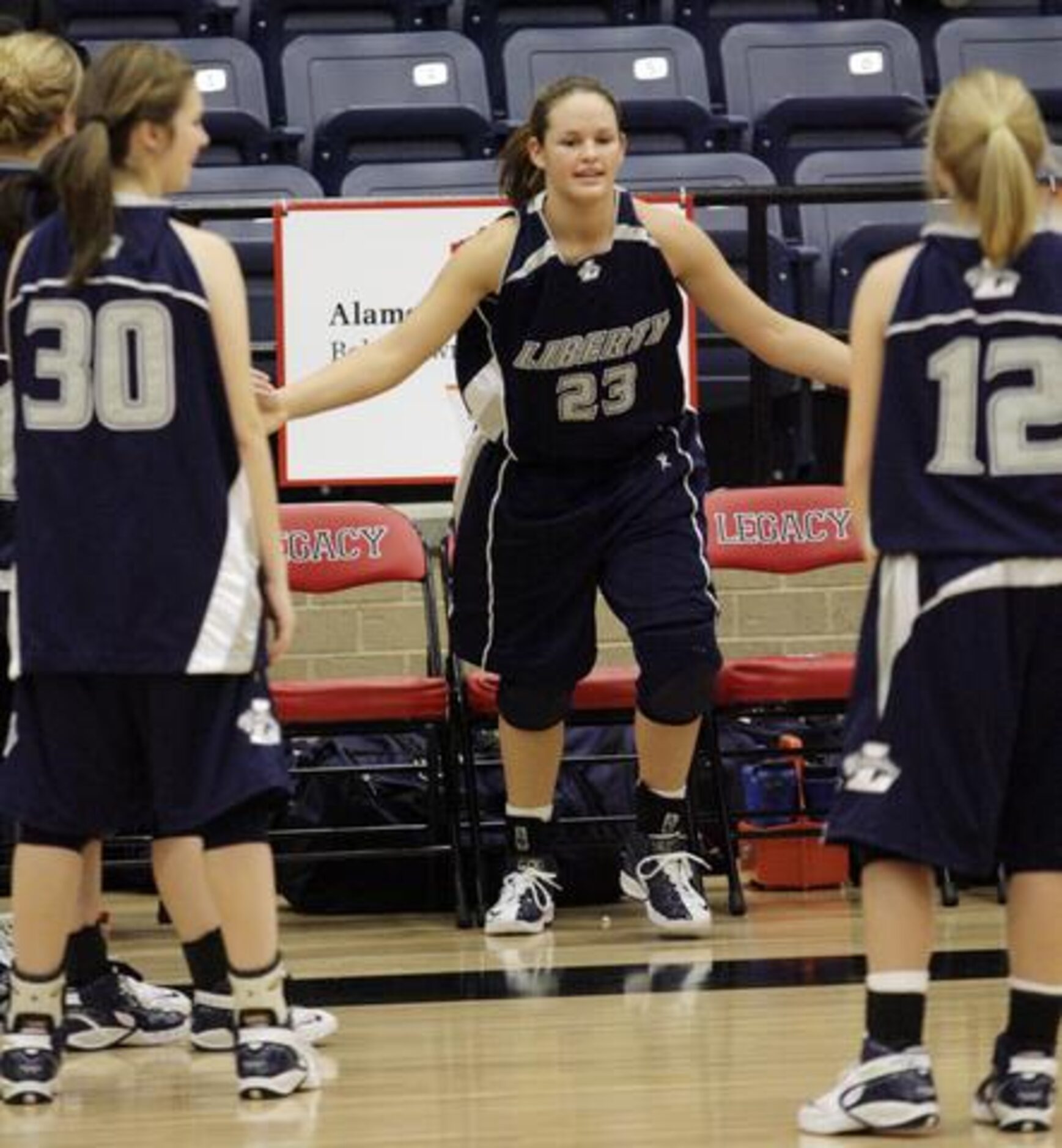 Argyle Liberty Christian senior forward Whitney Hand of Argyle Liberty Christrian greets her...